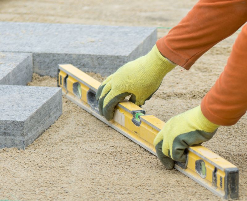 Leveling and compaction of pavers